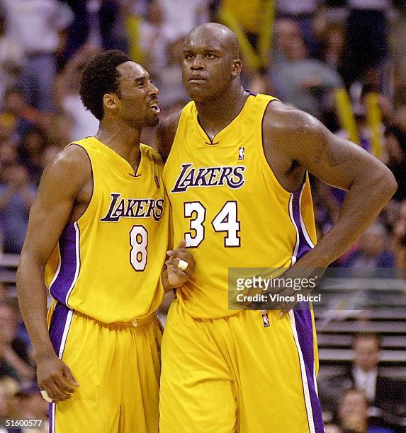 Los Angeles Lakers Kobe Bryant talks to teammate Shaquille O'Neal late in the 4th quarter during Game One of the NBA Western Conference first round...