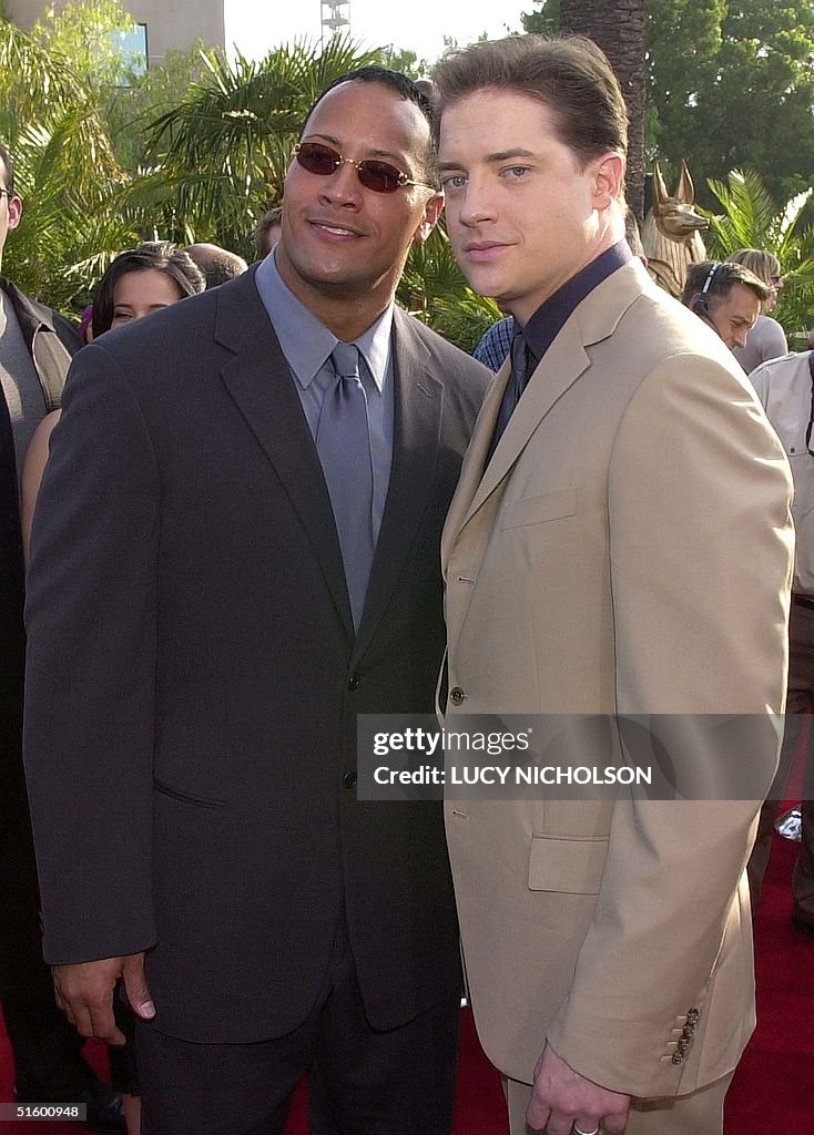 US actor Brendan Fraser (R) poses with co-star WWF