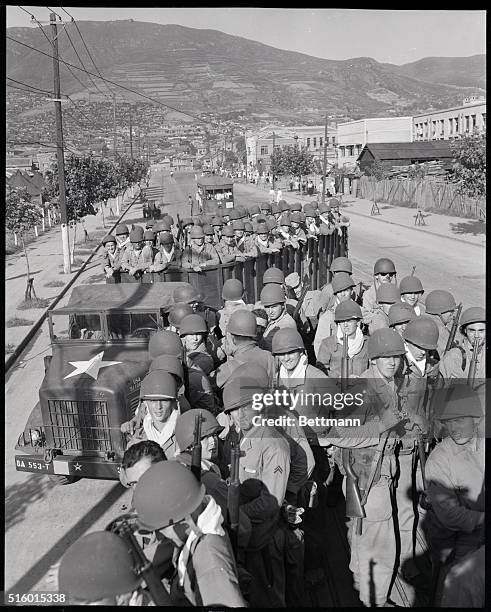 Pusan, Korea: Fresh and eager U.S. Marine troops, newly-arrived at the vital southern supply port of Pusan, are shown prior to moving up to the front...