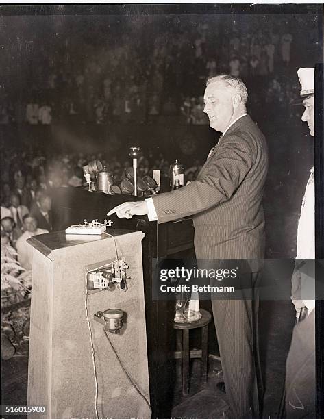 Washington, DC- President Franklin D. Roosevelt is pictured pressing the golden key that started the turbines of the government's greatest power...