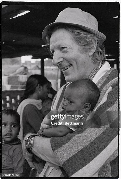 Actor Danny Kaye holds an Indian child during his United Nations International Children's Emergency Fund tour here November 1st.