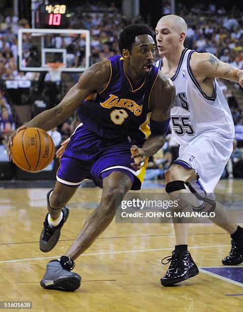 Los Angeles Lakers guard Kobe Bryant drives past Sacramento Kings guard Jason Williams during the first half of Game 3 of the Western Conference...