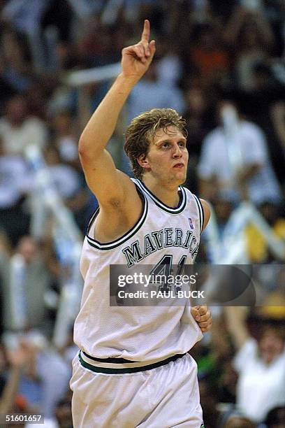 Dirk Nowitzki of the Dallas Mavericks responds to applause after hitting a clutch basket late in the game versus the San Antonio Spurs at Reunion...