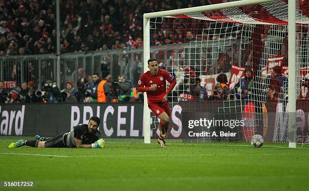 Thiago of Bayern Muenchen celebrates his goal as goalkeeper Gianluigi Buffon of Juventus Turin reacts during the Champions League round of 16 second...