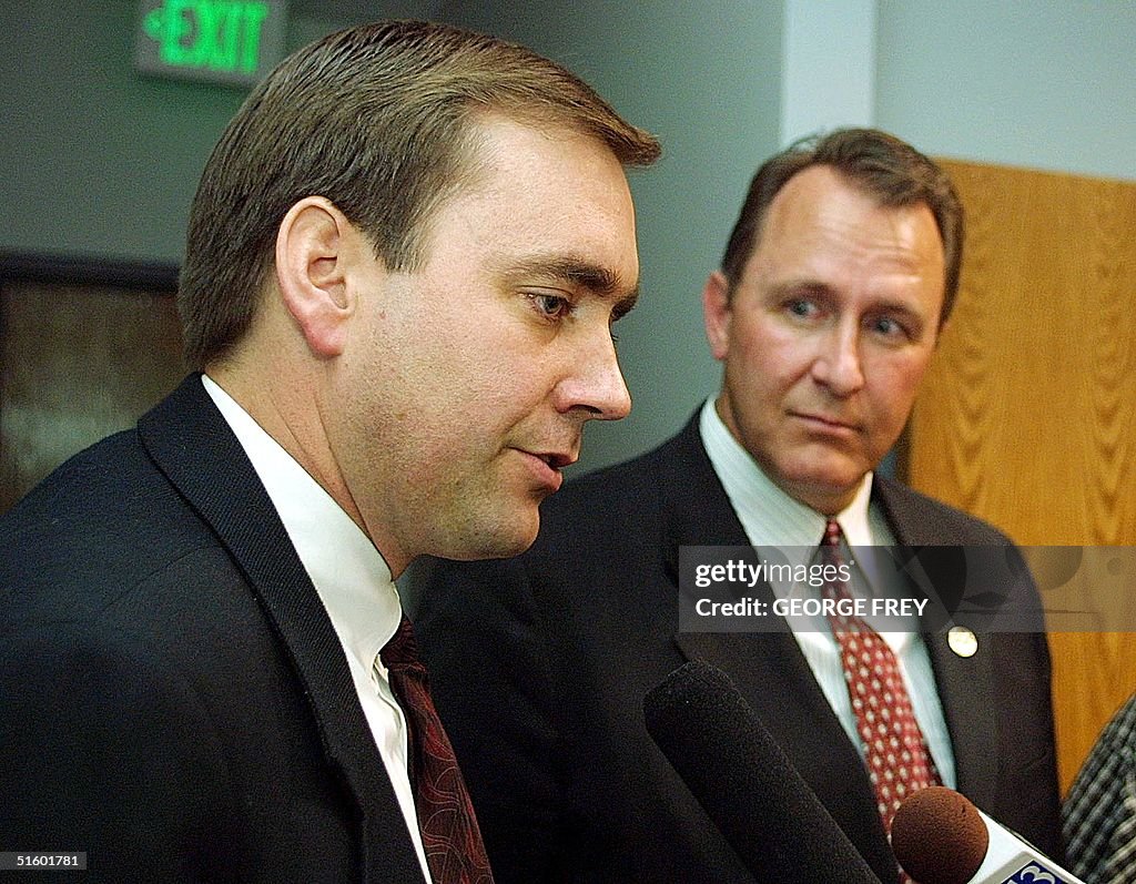 Juab County Prosecutor David Leavitt (L) talks wit