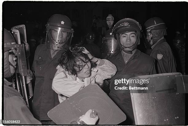 Tokyo riot police subdue a student October 10 during a street demonstration in downtown Tokyo. The manifestation took place following a protest rally...