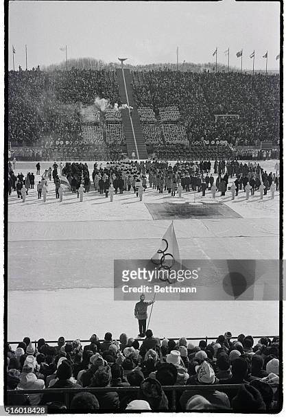Hideki Takada carries the Olympic torch to the top of Makamanai stadium 2/3 to light the giant brazier and officially open the XI Winter Olympic...