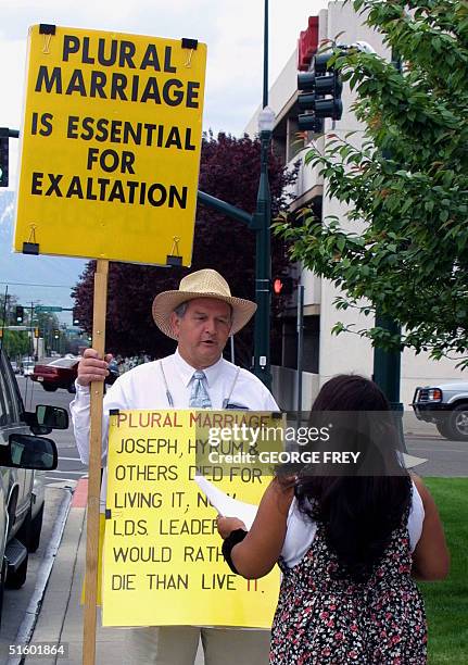 Gurnie Cook and Toni Carpentar argue the issue of plural marriage outside 4th District Court in Provo, Utah just before the start of the third day of...