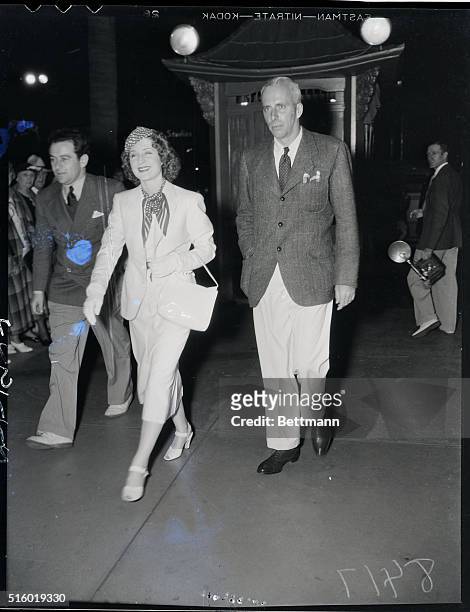 William Wyler, Norma Shearer and Howard Hawks enter the Chinese Theatre for a preview.