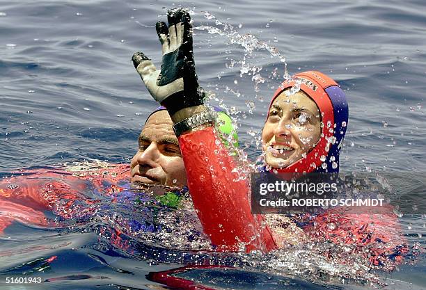 Frenchwoman Audrey Mestre Ferreras and her husband Pipin Ferreras celebrates after setting the first record in the mixed tandem free dive no limits...