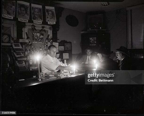 Yonkers, NY: Power failure in Westchester County and Yonkers. Charles Fedor, helps his sister in law, Mrs. Betty Havera to her home at 145 Stanley...