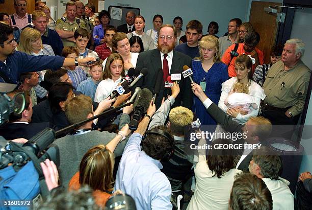 Utah polygamist Tom Green and part of his family is surrounded by reporters and on lookers after he was convicted of four counts of bigamy and one...