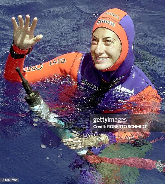 Audrey Mestre Ferreras smiles while holding on to a depth gauge moments after she reached the surface of the ocean off the coast of Ft. Lauderdale 19...