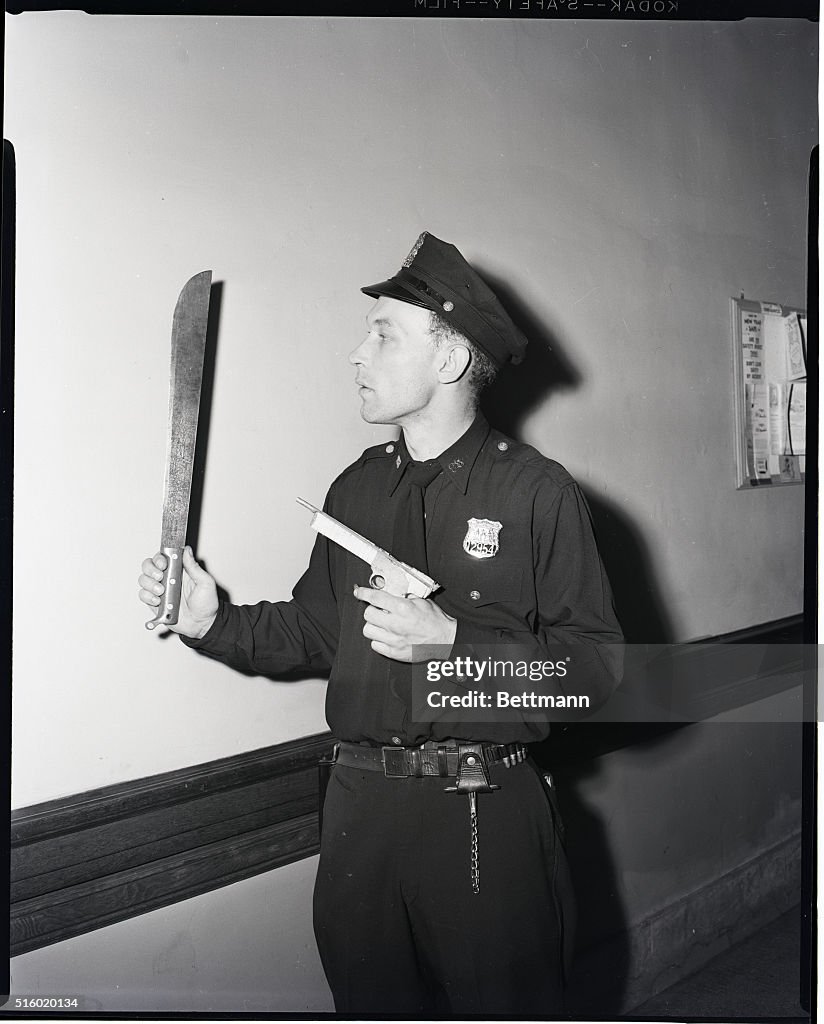 Policeman Holding Weapons