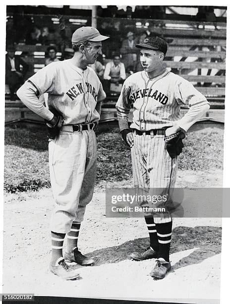 Carl Hubbell, of the New York Giants, left, and Bob Feller, the great kid pitcher of the Cleveland team, shown at game played in Rome, GA, and won by...