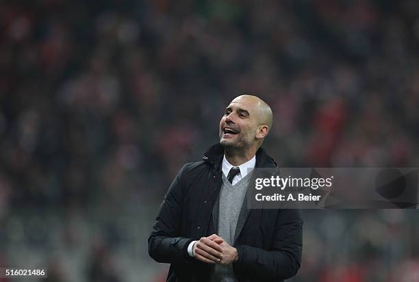 Team coach Josep Guardiola of Bayern Muenchen reacts after his team's third goal during the Champions League round of 16 second leg match between FC...