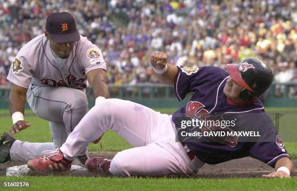 Cleveland Indians' catcher Einar Diaz gets back to third base just ahead of the tag attempt by Detroit Tigers' third baseman Jose Macias after over...