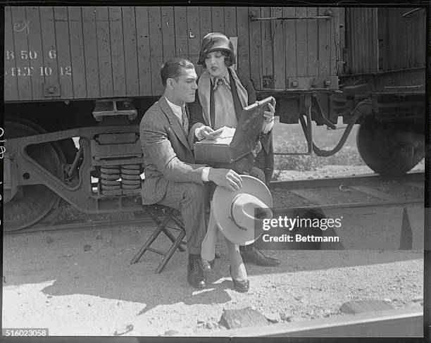 Photo shows Jack Dempsey and his wife, Estelle Taylor, in their first picture together, "Manhattan Madness." Estelle is sitting on her husband's lap,...