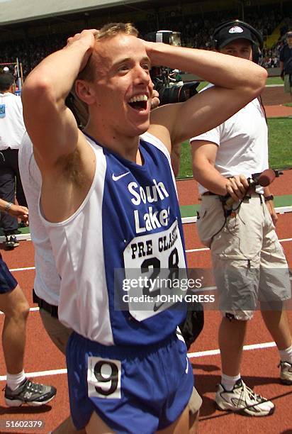 Alan Webb of the US reacts after breaking his country's High School Record in the men's mile at the Prefontaine Classic 27 May 2001 in Eugene,...