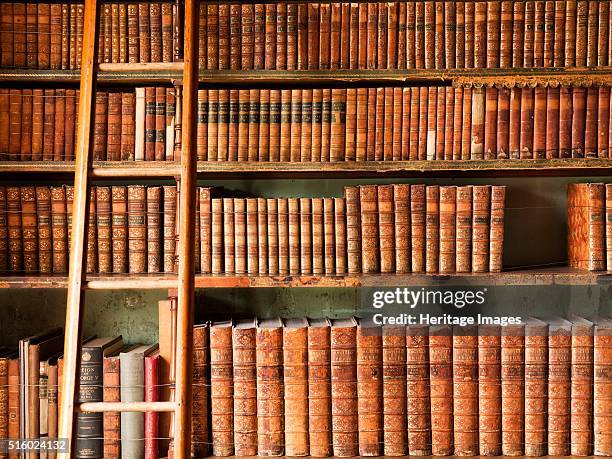 The library, Brodsworth Hall, South Yorkshire, c2000s. Detail of leather-bound books and ladder. Brodsworth was designed for Charles Thellusson by...