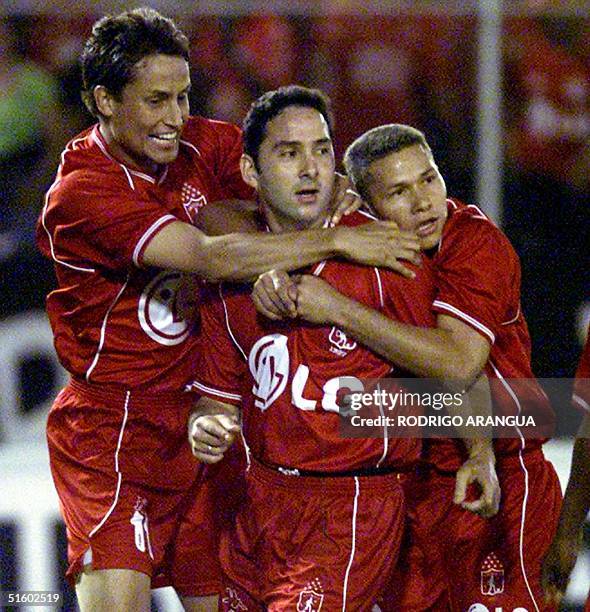 America de Cali player Julian Vasquez , celebrates the first goal against Rosario Central with his teammates, 29 May 2001, during a game of the...