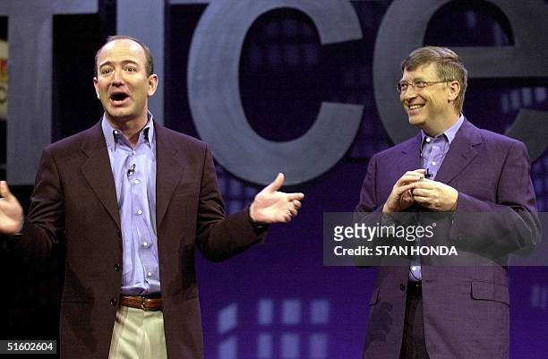 Amazon.com CEO Jeff Bezos tells a joke with Microsoft CEO Bill Gates at the Office XP launch, 31 May in New York. Gates and Bezos demonstrated new...
