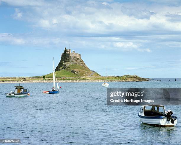 Lindisfarne Castle, Holy Island, Northumberland, c2000s. View from the west looking across the harbour with boats in the foreground. The island of...