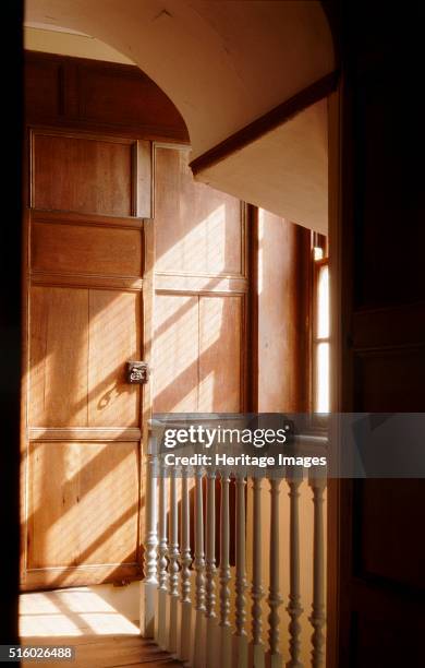 Great Yarmouth Row Houses, Norfolk, c2000s. Interior view of the Old Merchant's House. The first floor staircase looking east with sunlight coming...