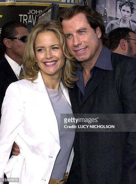 Actor John Travolta arrives at the premiere of his new film "Swordfish" with his wife, actress Kelly Preston, in Los Angeles, 04 June 2001. AFP...