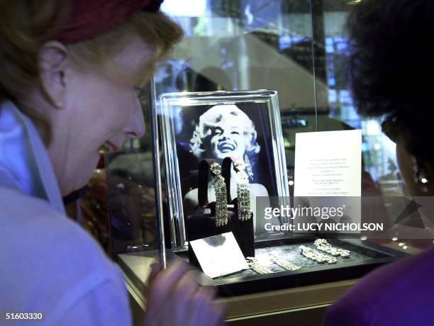 Buyers view earrings Marilyn Monroe wore to sing "Diamonds are a Girl's Best Friend" in the film "Gentlemen Prefer Blondes" and to sing "Happy...