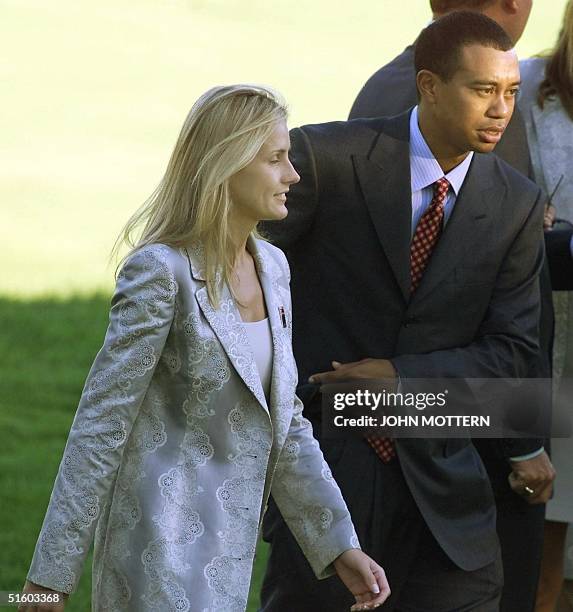 Us Ryder Cup team member Tiger Woods walks with his girlfriend Joanna Jagoda 23 September, 1999 after opening ceremonies at The Country Club in...