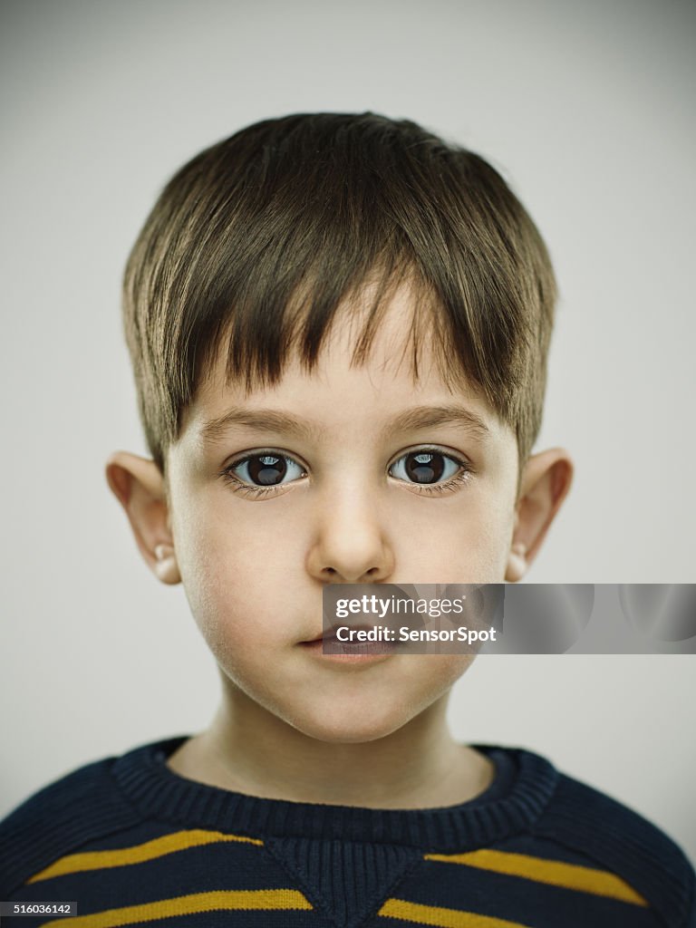 Portrait of a smiling kid looking at camera.