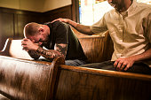 Men Pray Together in Church