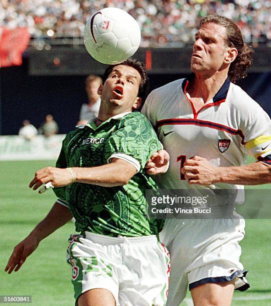 Jose Manuel Abundis of Mexico and Jeff Agoos of Team USA go for the ball during their Nike US Cup soccer match 13 March 1999 in San Diego, Ca. Mexico...