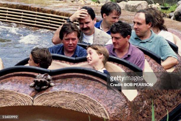 Prince William of Wales grimaces after he and friends of the royal family finished their ride 26 August 1993 on Splash Mountain at Disney World's...