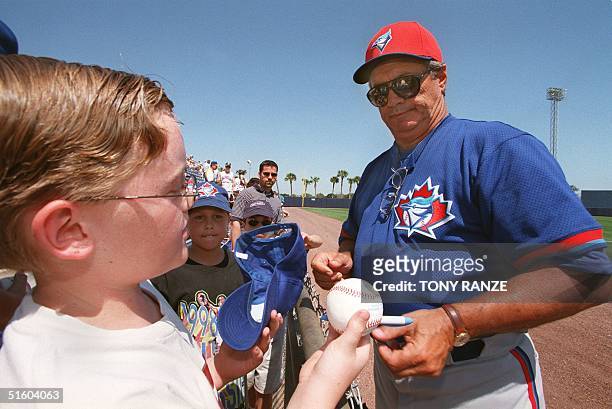 Toronto Blue Jays new manager Jim Fregosi stops to sign autographs before a spring training game with the Detroit Tigers 1999 March 1999 at Marchant...