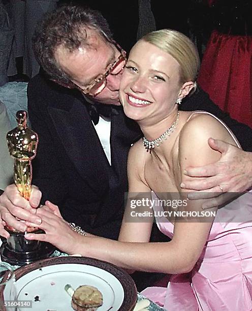 Actress Gwyneth Paltrow is kissed by her father, director Bruce Paltrow , at the Governor's Ball following the 71st Annual Academy Awards in Los...