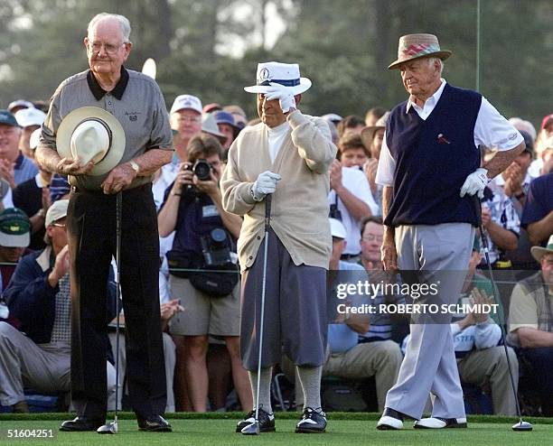 In this 08 April 1999 file photo, golf legend Gene Sarazen tips his hat as Byron Nelson and Sam Snead look on 08 April 1999 before acting as honorary...