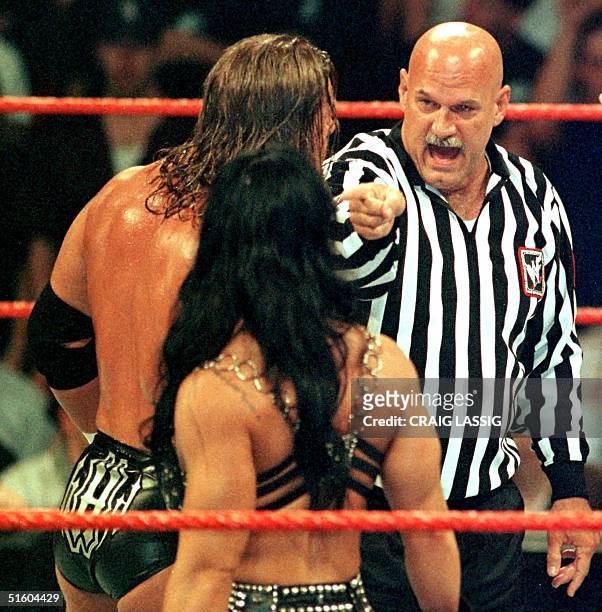 Minnesota Governor and former professional wrestler Jesse Ventura points during an argument with wrestler Triple H and Chyna , who left the ring soon...
