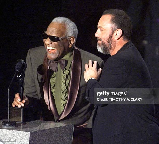 Rock and Roll Hall of Fame inductee Billy Joel is introduced by Ray Charles during the 15th Rock and Roll Hall of Fame Induction Ceremony 15 March...