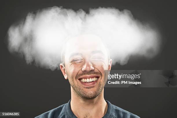 smiling man with head in cloud - distraído imagens e fotografias de stock
