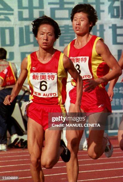 Wang Junxia , world record holder in women's 10,000 and 3,000 meters, outruns Qu Yunxia world record holder in women's 1,500 meters in the finals of...