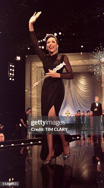 Miss America Kimberly Clarice Aiken waves to the crowd as she walks down the runway after the former Miss South Carolina was crowned 18 September...