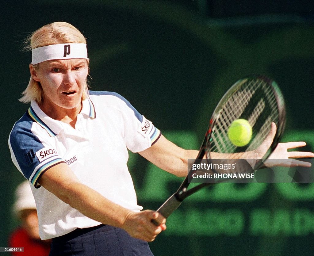 Jana Novotna of the Czech Republic returns a shot