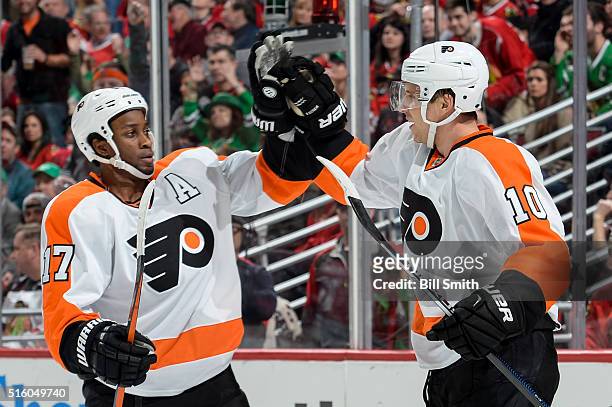 Brayden Schenn of the Philadelphia Flyers celebrates with Wayne Simmonds after scoring against the Chicago Blackhawks in the second period of the NHL...