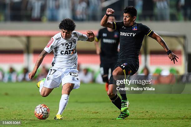 Luan of Atletico MG and Esteban Pavez of Colo Colo battle for the ball during a match between Atletico MG and Colo Colo as part of Copa Bridgestone...