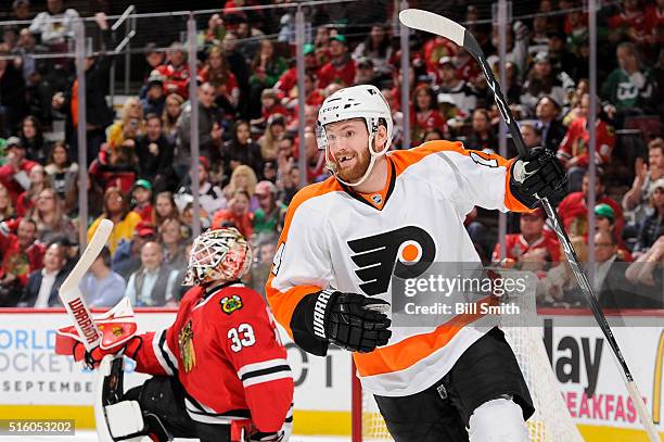 Sean Couturier of the Philadelphia Flyers reacts after assisting in scoring on goalie Scott Darling of the Chicago Blackhawks in the third period of...