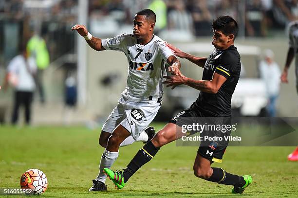 Robinho of Atletico MG and Esteban Pavez of Colo Colo battle for the ball during a match between Atletico MG and Colo Colo as part of Copa...