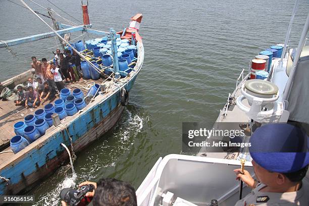 Indonesian Police officers catch illegal Malaysian fishing boats and 11 crews from Thailand, 3 from Myanmar, on March 16, 2016 in Indonesian sea,...