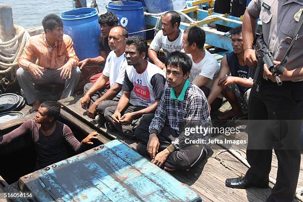 Indonesian Police officers catch illegal Malaysian fishing boats and 11 crews from Thailand, 3 from Myanmar, on March 16, 2016 in Indonesian sea,...